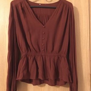 Dark red long-sleeved v-necked peplum top